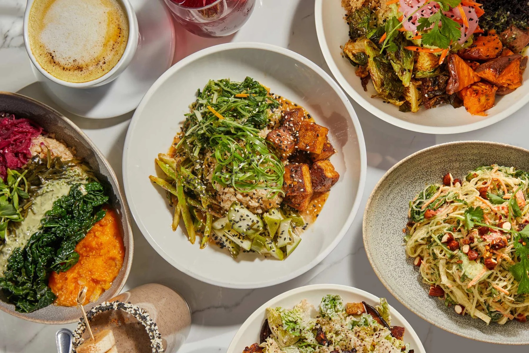 A table of plant-based food from Cafe Gratitude.