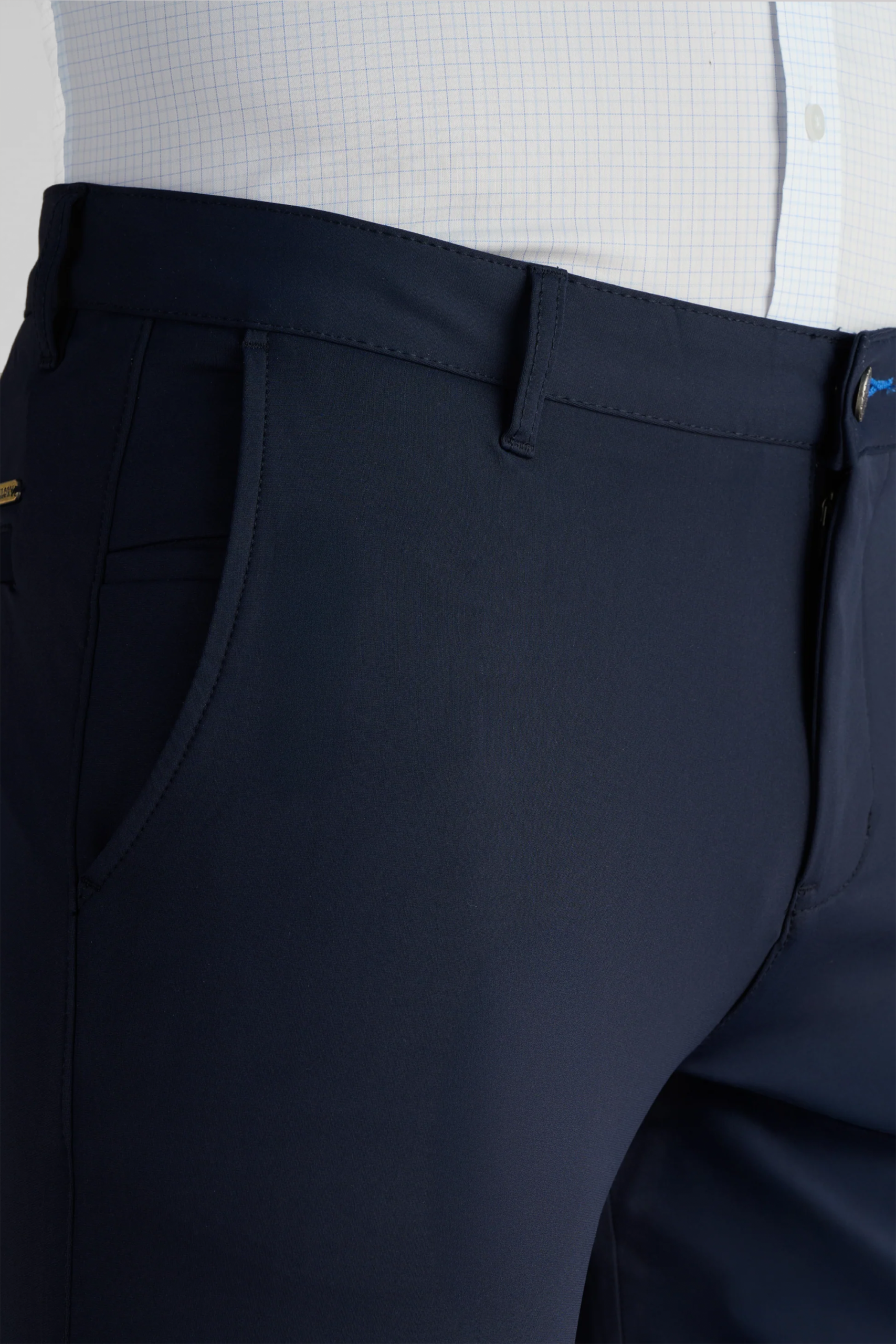 Close view of navy Twillory performance pants at the waist and pocket.