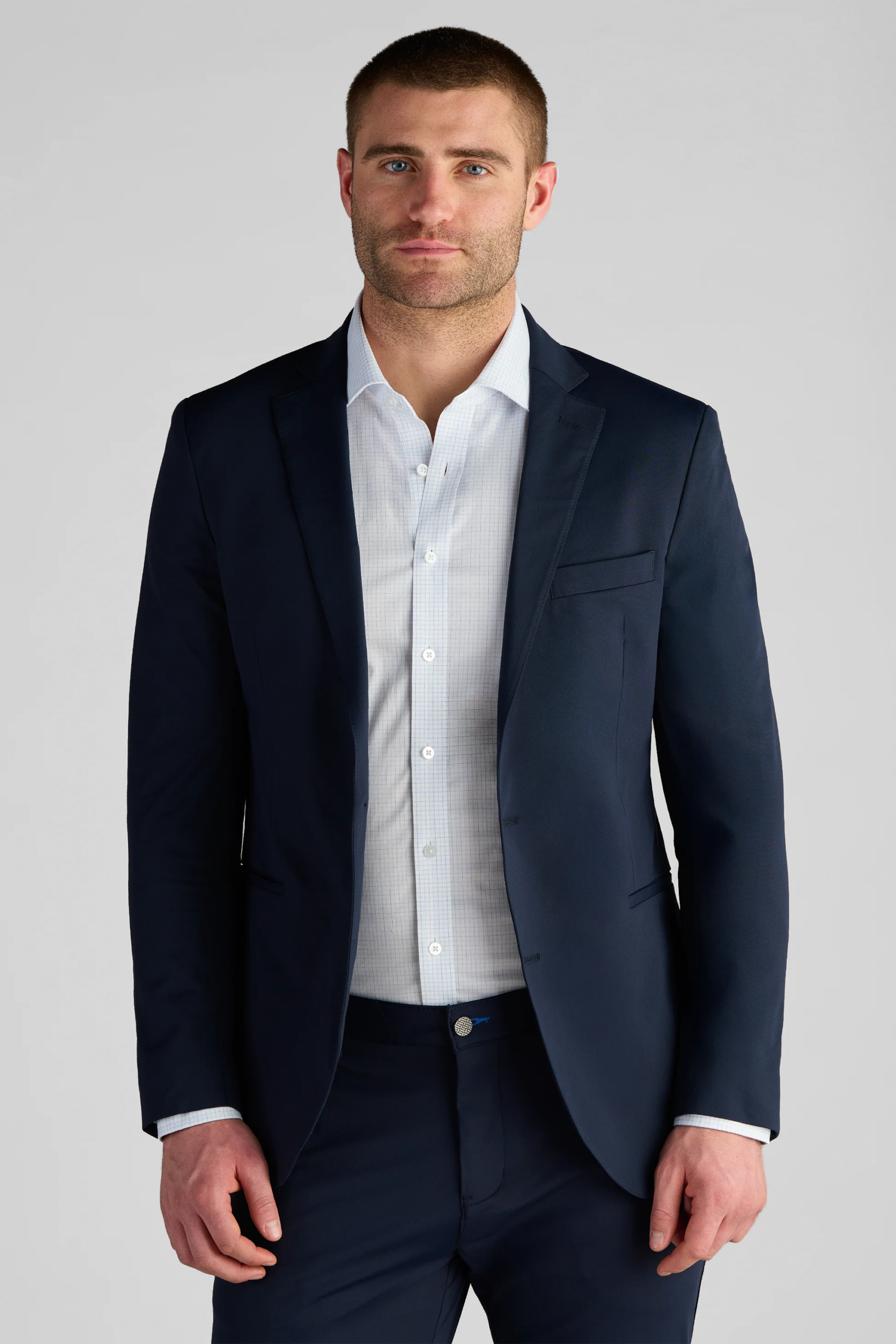 Twillory navy performance blazer shown on a model.