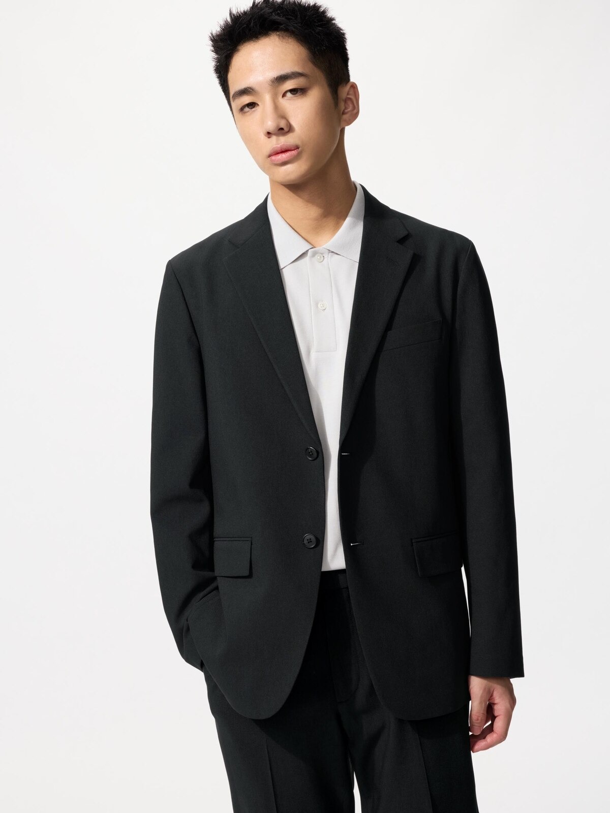UNIQLO black AirSense wool-like blazer.