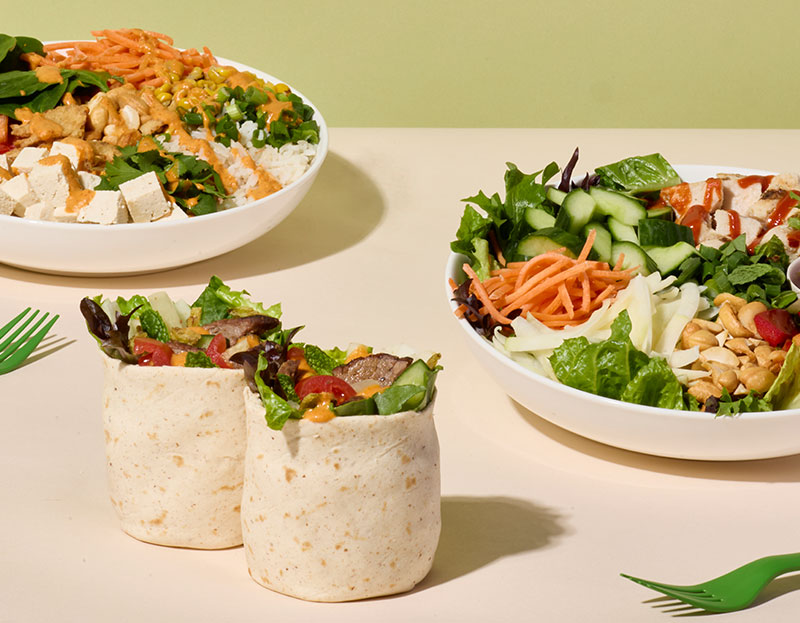 Evergreens bowls and wrap with vegetables, greens, rice, avocado, and tofu-style toppings at PDX.