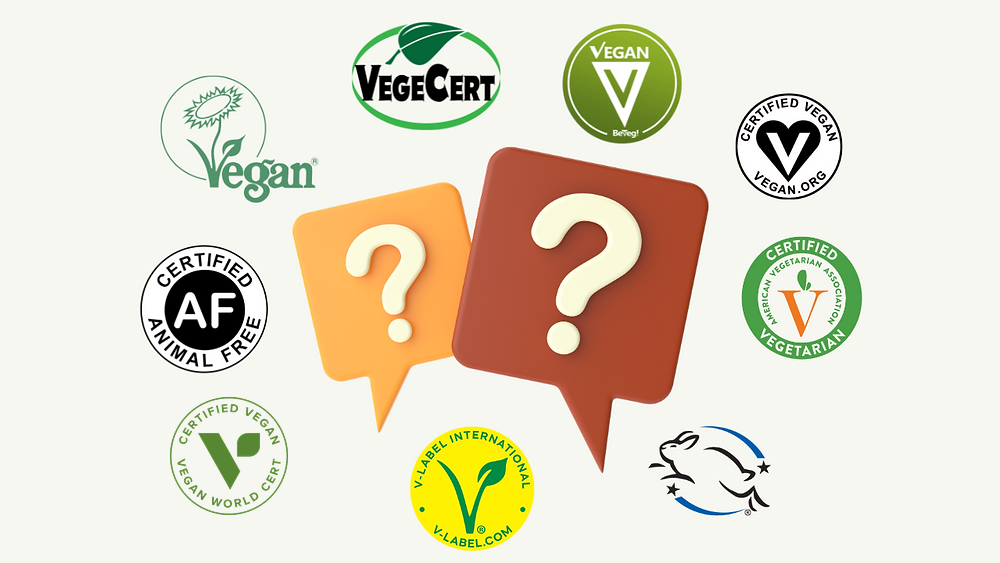 Vegan certification and label marks arranged around question mark cards with EVE removed