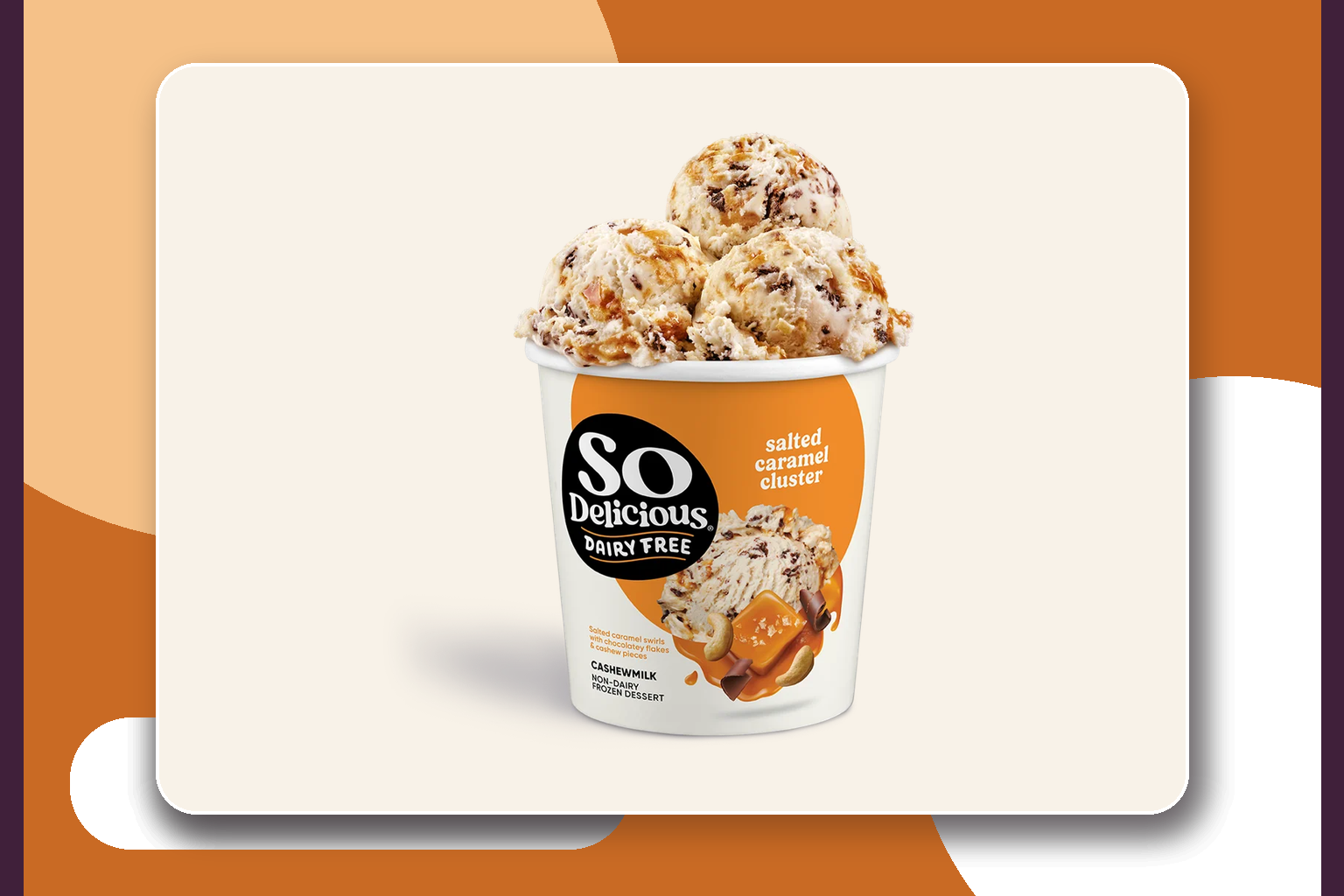 Open So Delicious Salted Caramel Cluster Cashewmilk pint topped with scoops showing caramel, chocolate flakes, and cashew pieces.