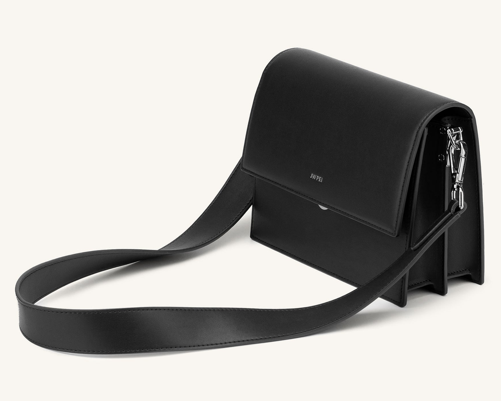 Black JW PEI Mini Flap Crossbody with a rectangular shape, silver push lock, narrow border, side gussets, and detachable, nonadjustable shoulder strap.