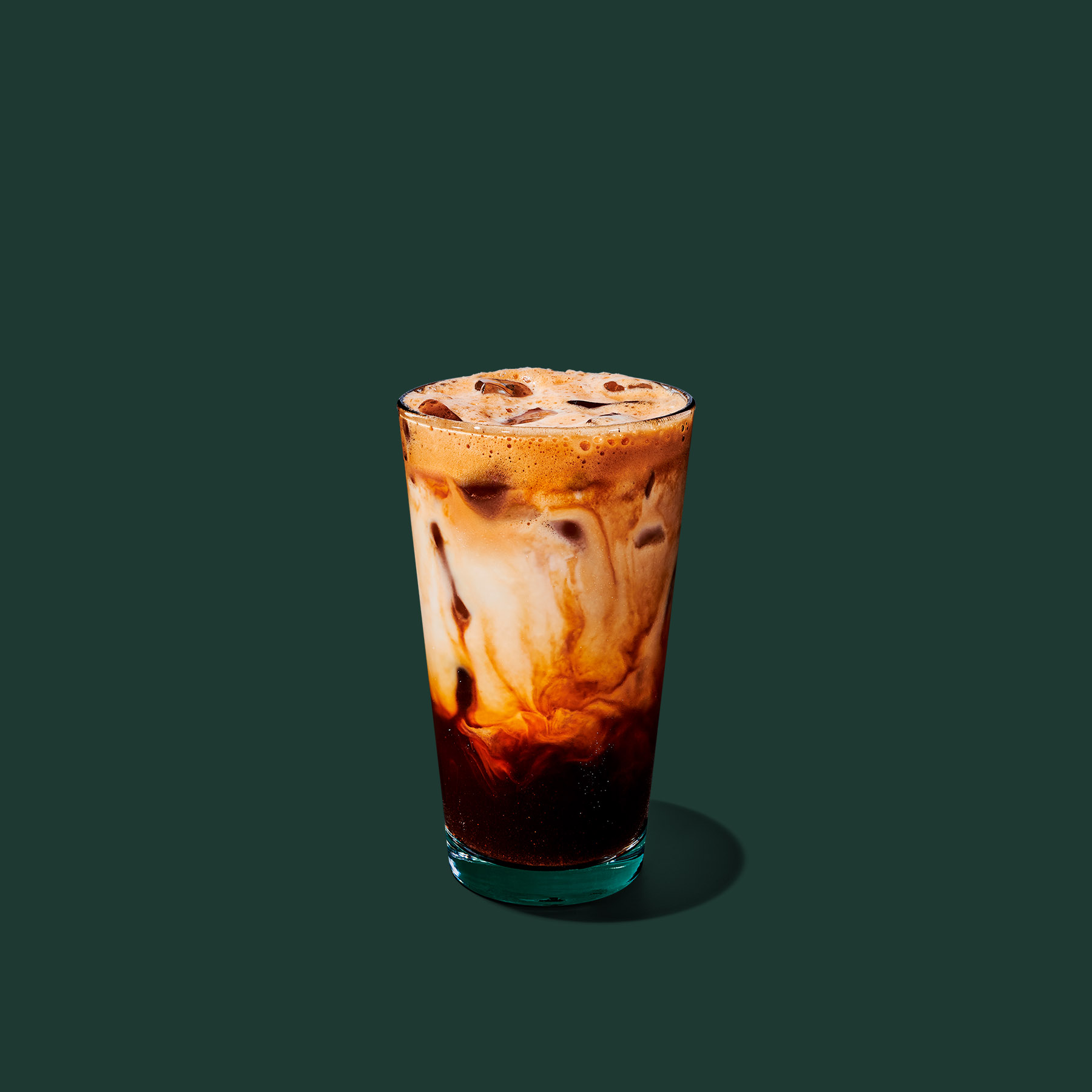 Iced Brown Sugar Oatmilk Shaken Espresso with visible espresso, ice, and oatmilk layers.
