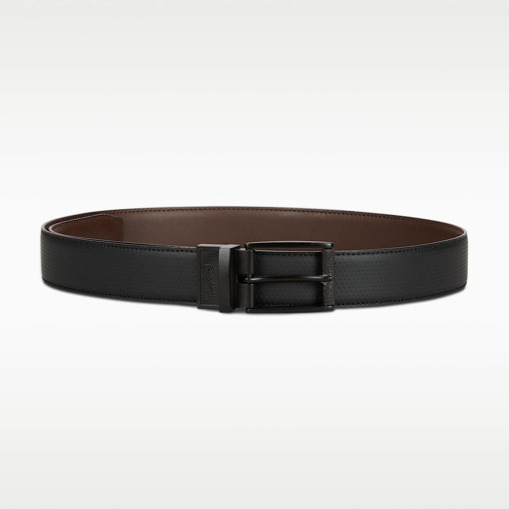 Black-and-brown Nike reversible belt looped with a black buckle.