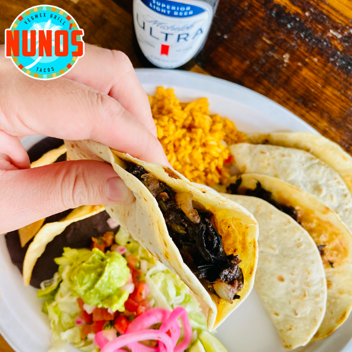 Vegan food at Nuno's: hibiscus Barbacoa Taco Plate with rice, beans, and guacamole.